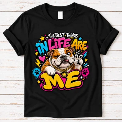 bulldog pride shirt artwork with a winking brown-and-white bulldog, peace-sign paw, crown medallion, neon text, stars, hearts, and paw prints.