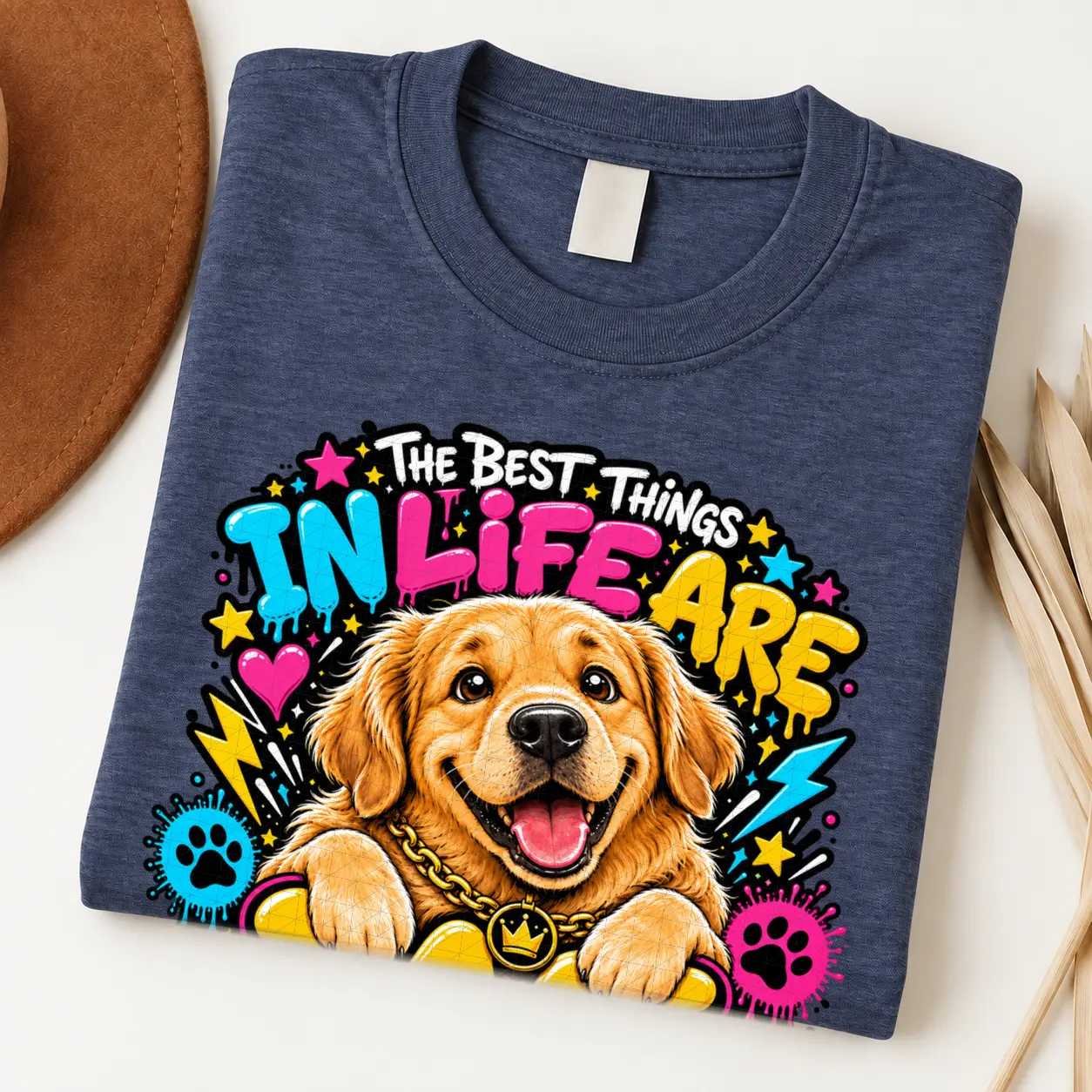 Golden Retriever pride shirt artwork with a smiling golden dog, tongue out, crown medallion, bold neon lettering, hearts, paw prints, and lightning bolts.