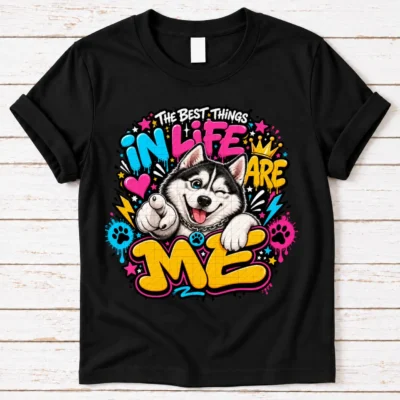 Husky pride shirt artwork with a winking black-and-white Husky, pointing paw, blue eye, crown medallion, neon lettering, bolts, hearts, and paw prints.