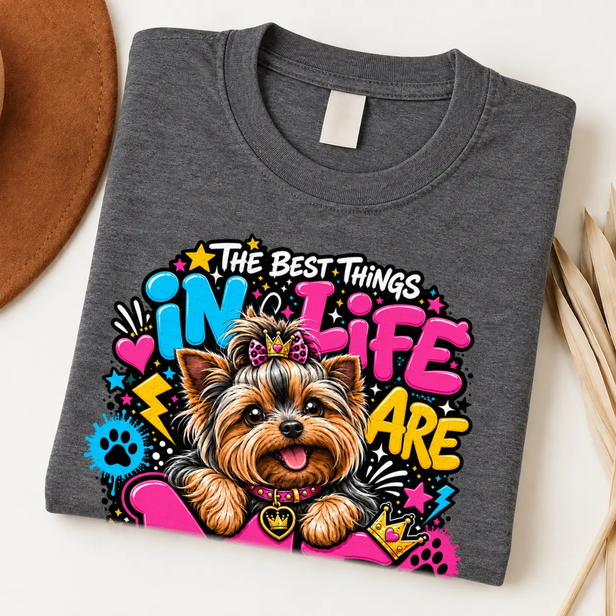 Yorkie pride shirt artwork with a Yorkshire Terrier wearing a pink bow, small crown, pink collar, crown medallion, neon lettering, hearts, and paw prints.