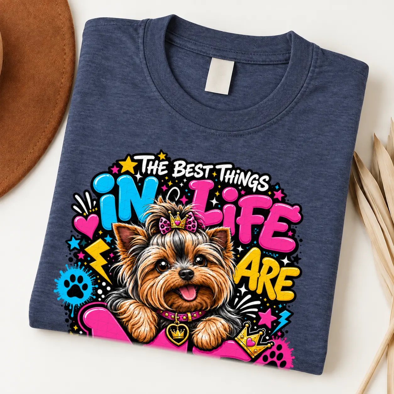 Yorkie pride shirt artwork with a Yorkshire Terrier wearing a pink bow, small crown, pink collar, crown medallion, neon lettering, hearts, and paw prints.