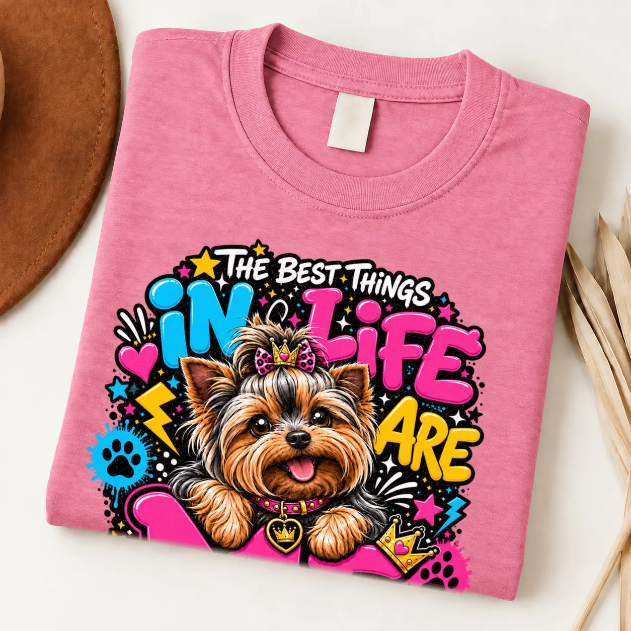 Yorkie pride shirt artwork with a Yorkshire Terrier wearing a pink bow, small crown, pink collar, crown medallion, neon lettering, hearts, and paw prints.