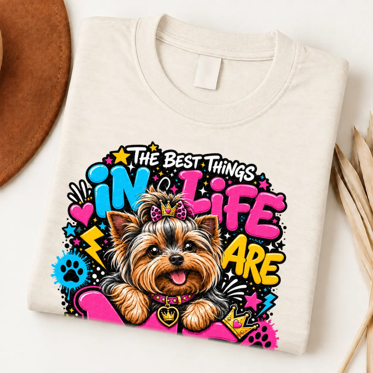 Yorkie pride shirt artwork with a Yorkshire Terrier wearing a pink bow, small crown, pink collar, crown medallion, neon lettering, hearts, and paw prints.